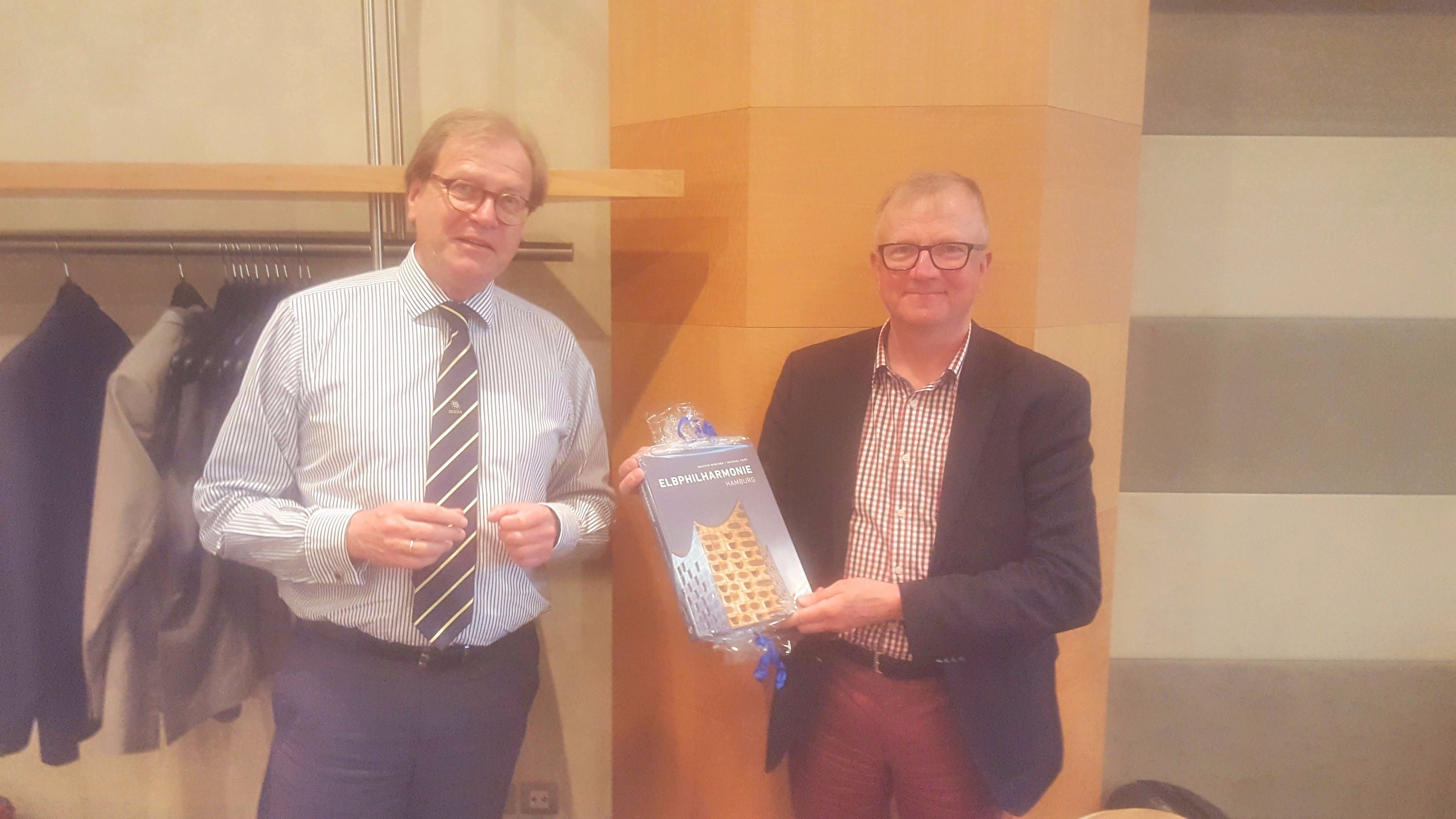 Wolfgang Sump (left) presents the souvenir book to Matti Kokkala to mark his many years of distinguished service to OCEAN and to wish him a long and happy retirement.